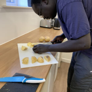 resident chopping potatoes