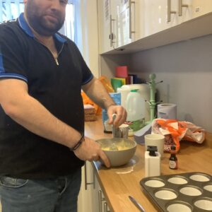 resident making cupcake mix