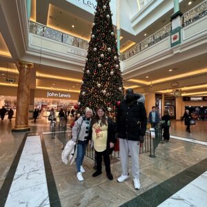 residents in front of giant Christmas tree