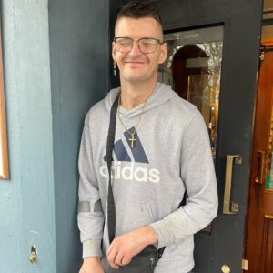 resident in grey hoodie