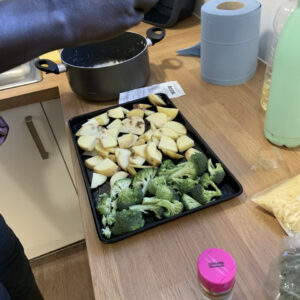 tray of chopped potatoes and broccoli