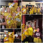 residents and team members wearing yellow Pudsey tshirts and posing with Pudsey bear