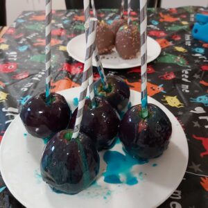 Toffee apples with blue food colouring