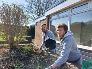 Two Kirk House residents gardening
