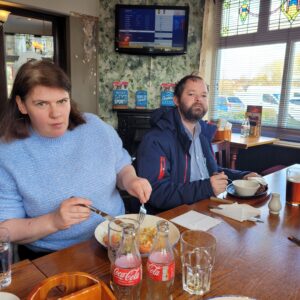 male and female enjoying pub lunch