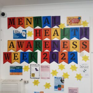 coloured bunting spelling "Mental Health Awareness Week 2022"