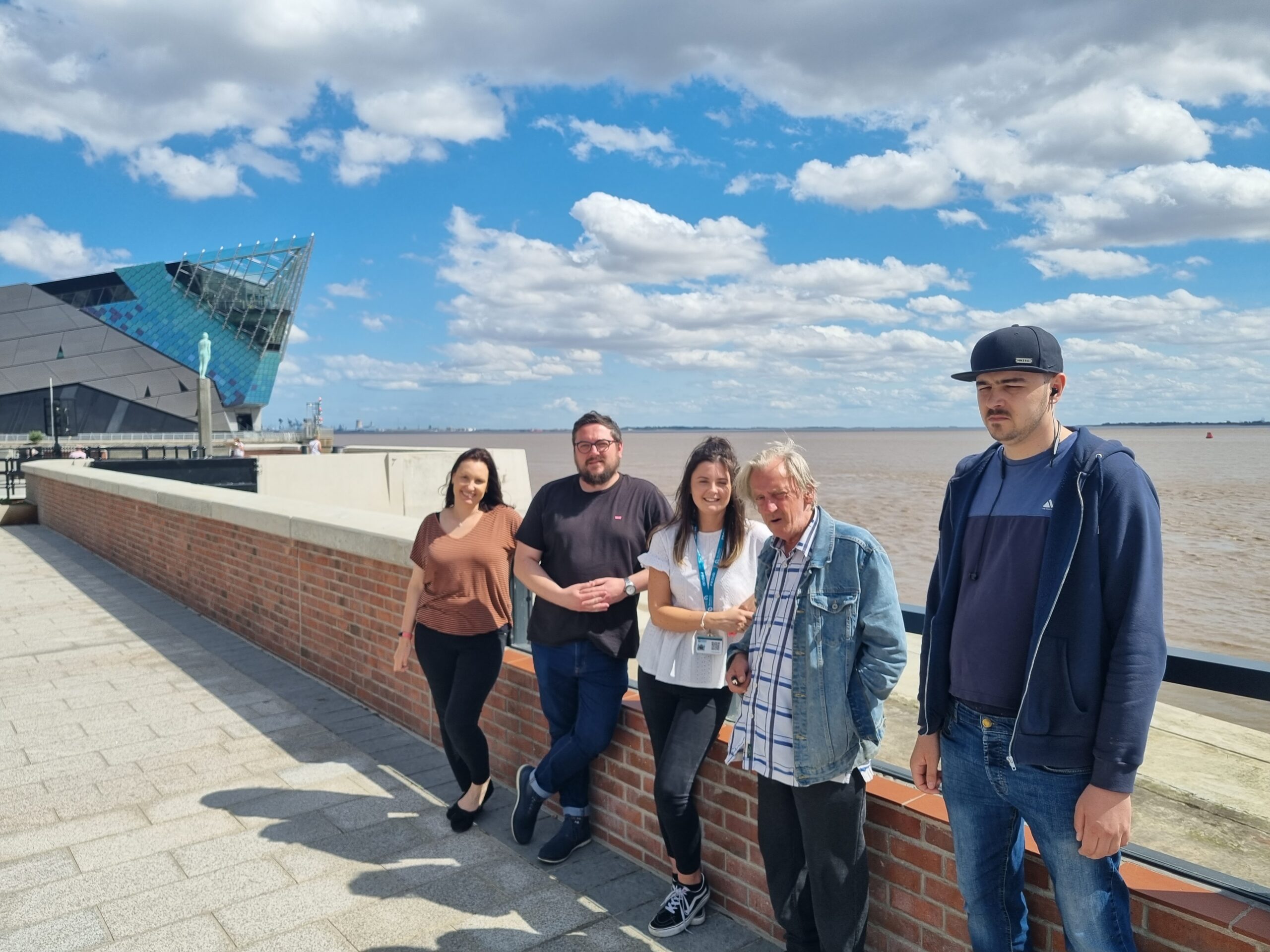team members and residents on promenade