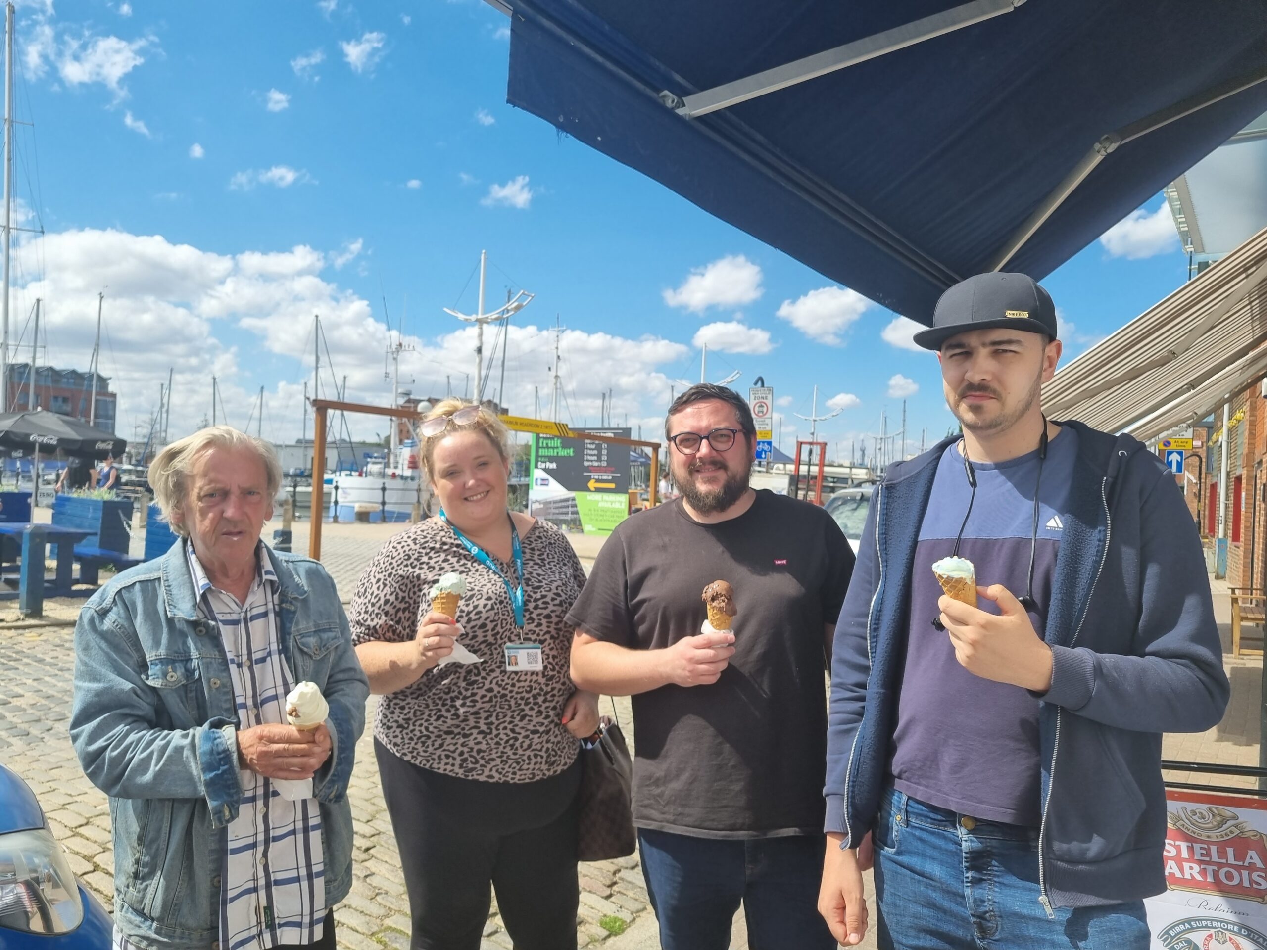Amy Johnson House resident networking event: team members and residents on promenade eating ice creams