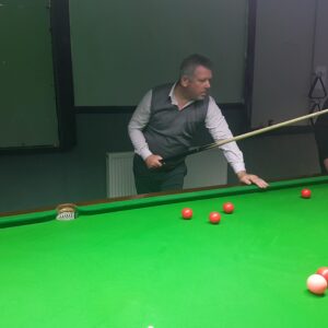 male playing snooker