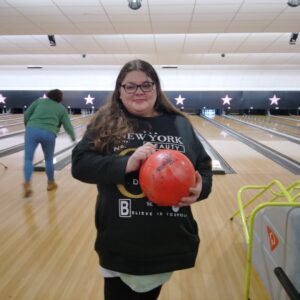 resident holding bowling ball