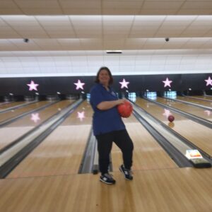 resident holding bowling ball