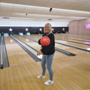 OT Support Worker holding bowling ball