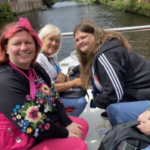 Residents and team members on a boat
