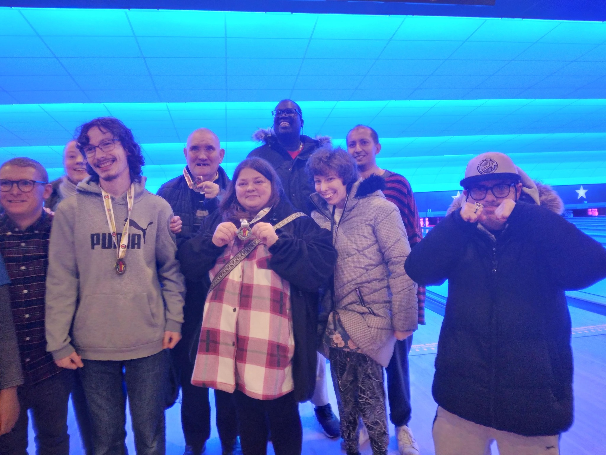 Residents in front of a bowling alley