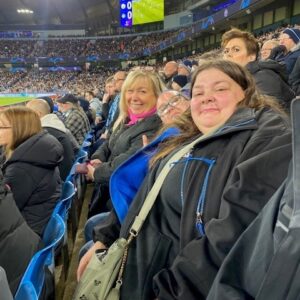 residents and support worker at Man City game