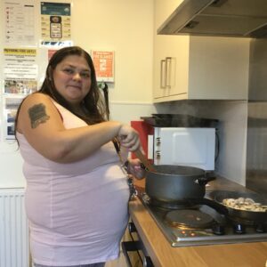 resident cooking on stove