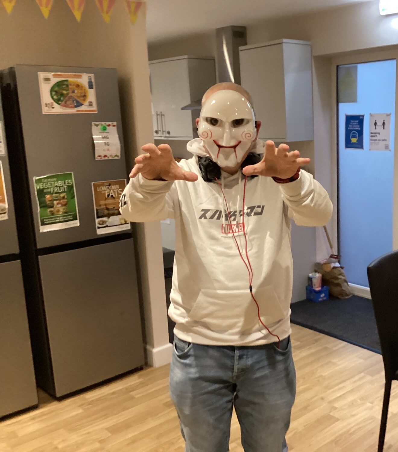 resident dressed in Halloween mask