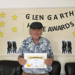 resident with award certificate