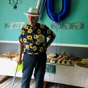 resident in front of 70th balloons