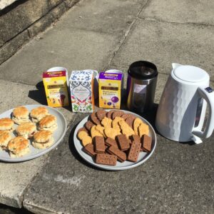 plate of scones and biscuits, and tea bags and kettle