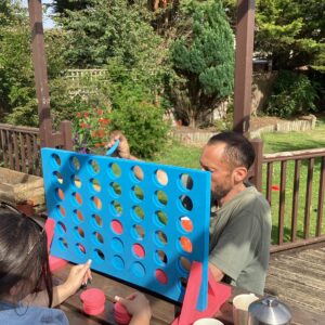 resident playing giant connect 4