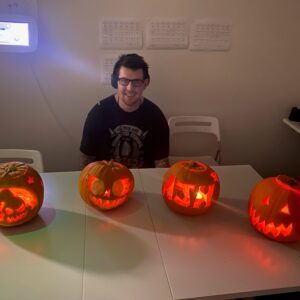 resident with pumpkins