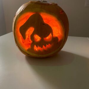 ghost carved into pumpkin