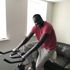 resident in pink top on exercise bike