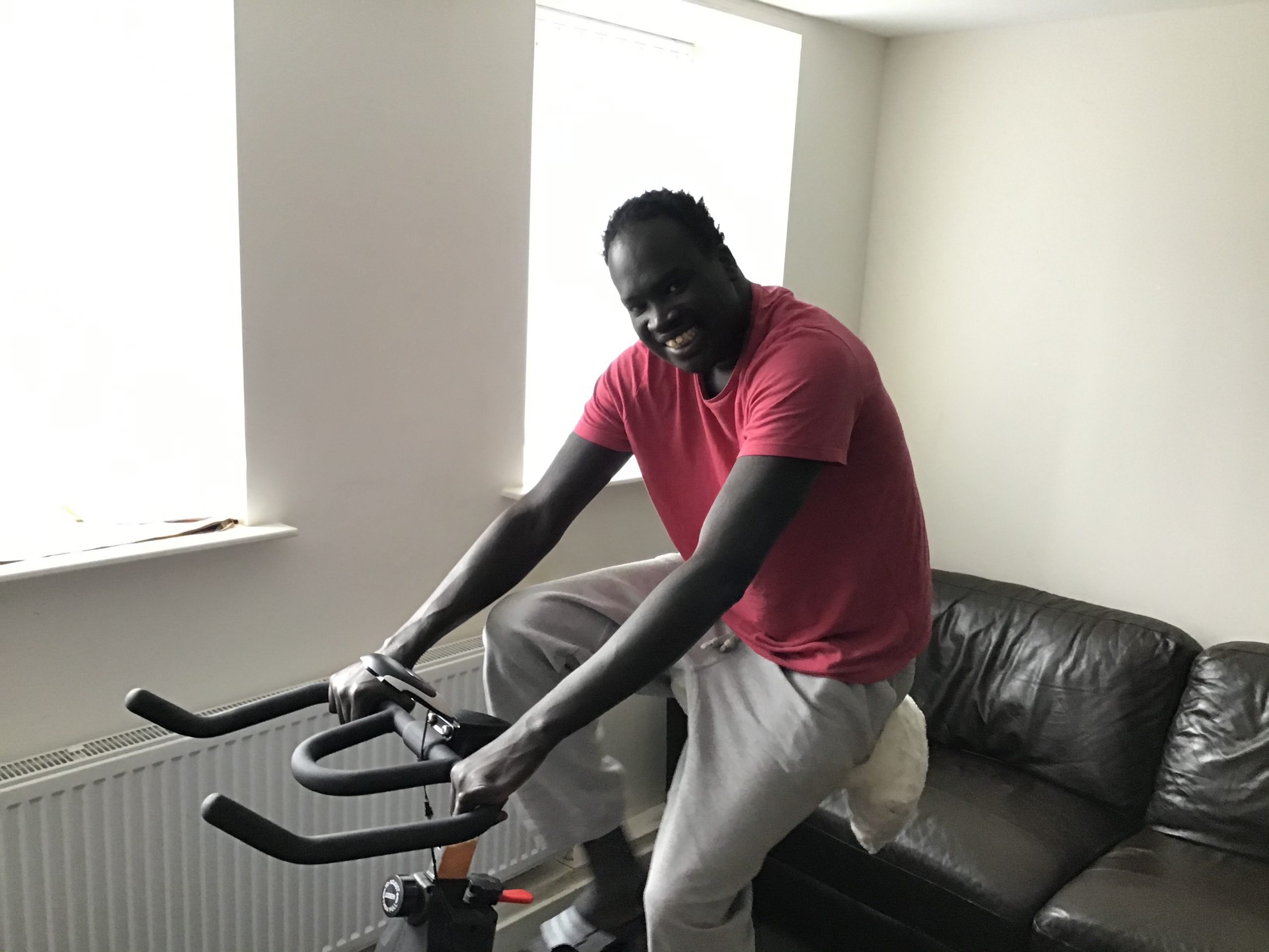 resident in pink top on exercise bike