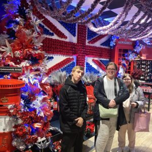 residents standing in front of christmas lights in shape of union jack