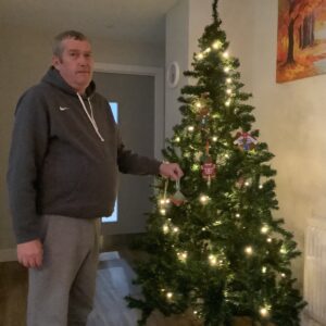 merry christmas 2021: resident decorating christmas tree