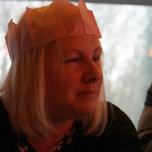 woman in paper party hat