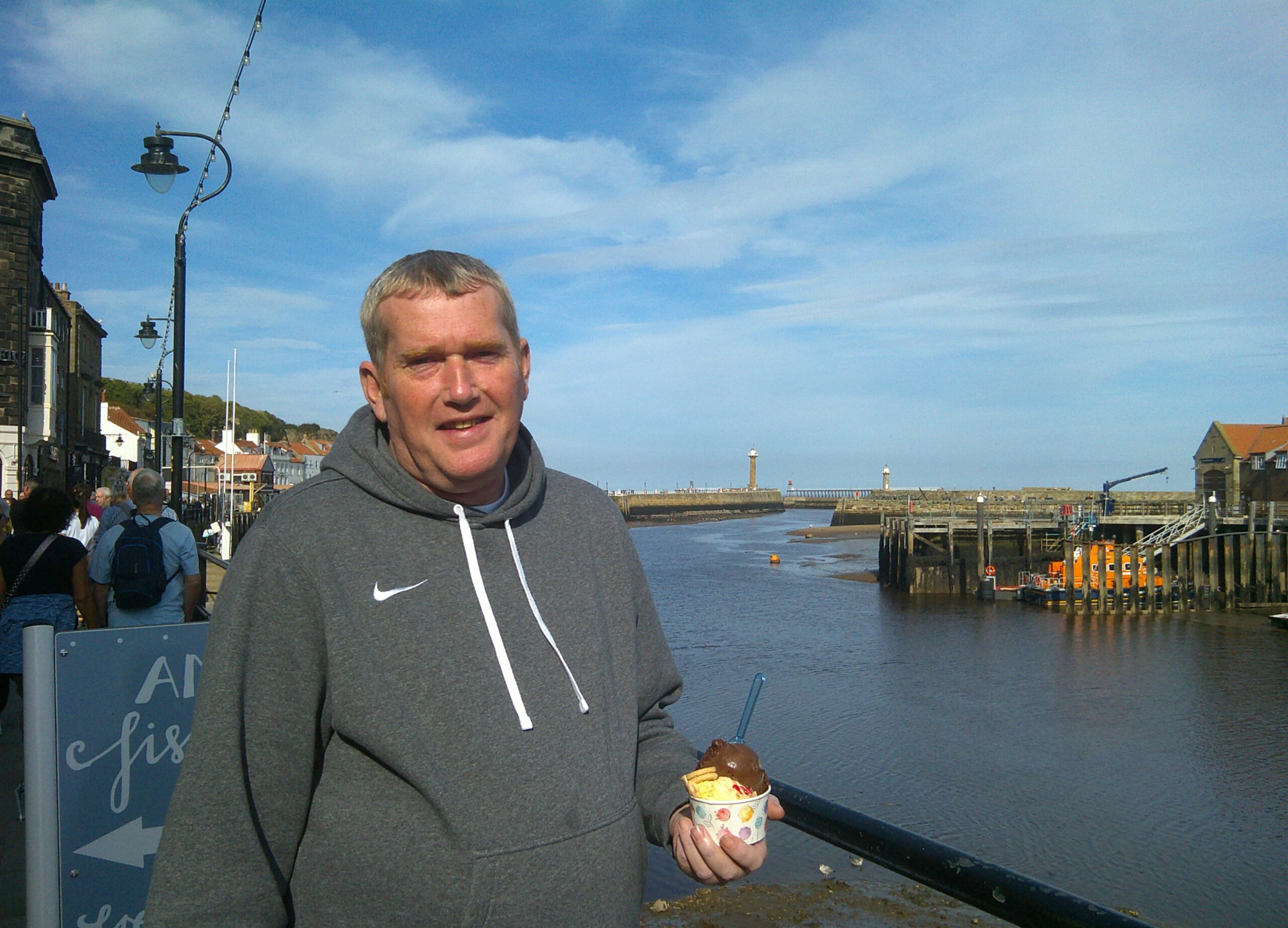 resident enjoying ice cream on seafront