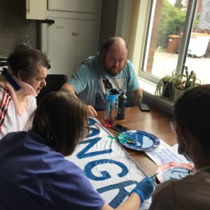 residents painting banner