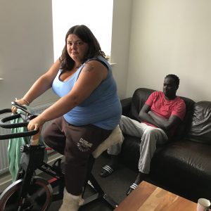 female resident on exercise bike