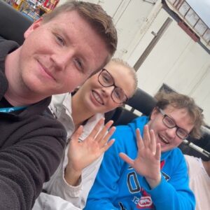 residents and team members on fairground ride