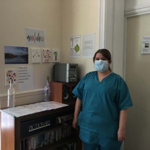 team member next to mindfulness corner