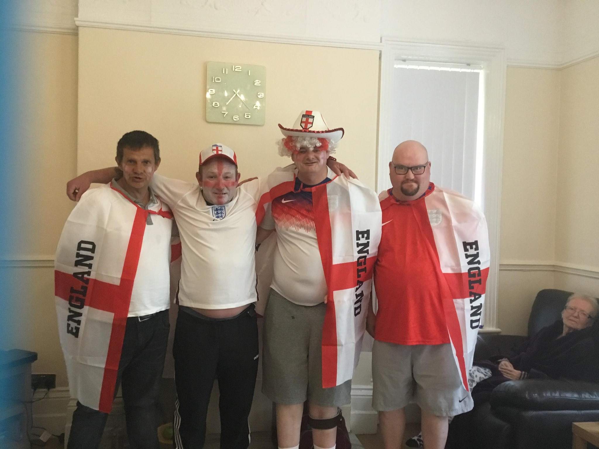 life at Glen Garth: residents dressed in england tops, facepaint and hats