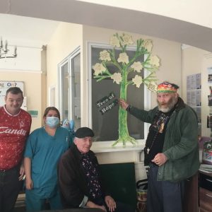 residents with tree of hope display