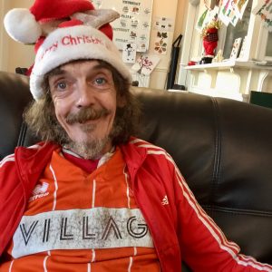 resident wearing christmas hat