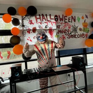 resident dressed as clown DJ