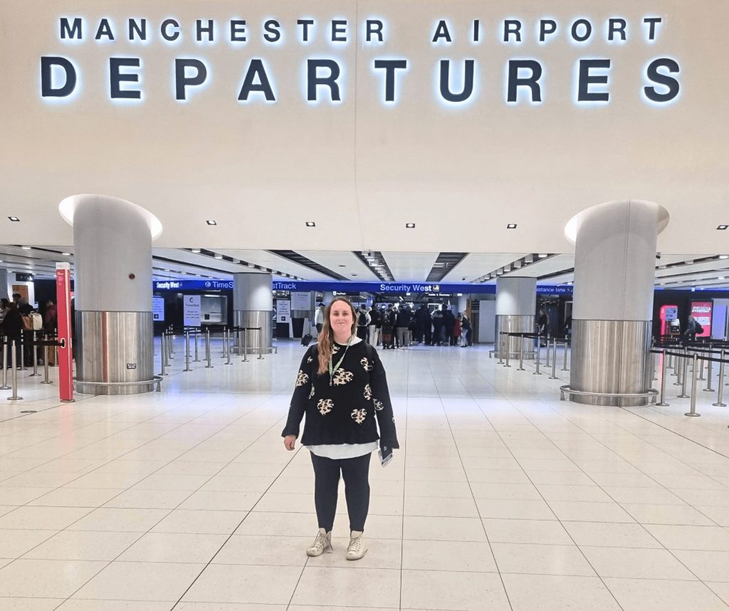 A person supported at Northern Healthcare's supported living service, Amy Johnson House embarking on their first holiday abroad to Tenerife with help from staff.
