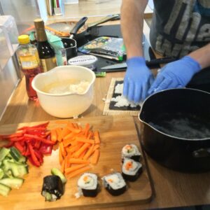 residents preparing sushi