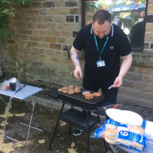 service manager cooking on the bbq