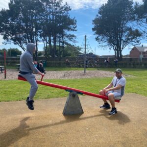 two residents on seesaw