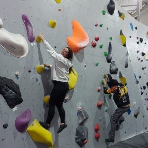 residents on climbing wall