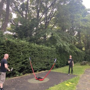 residents playing badminton in the garden