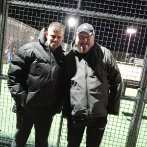 2 male residents outdoors