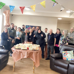 Kirk House team and residents celebrating