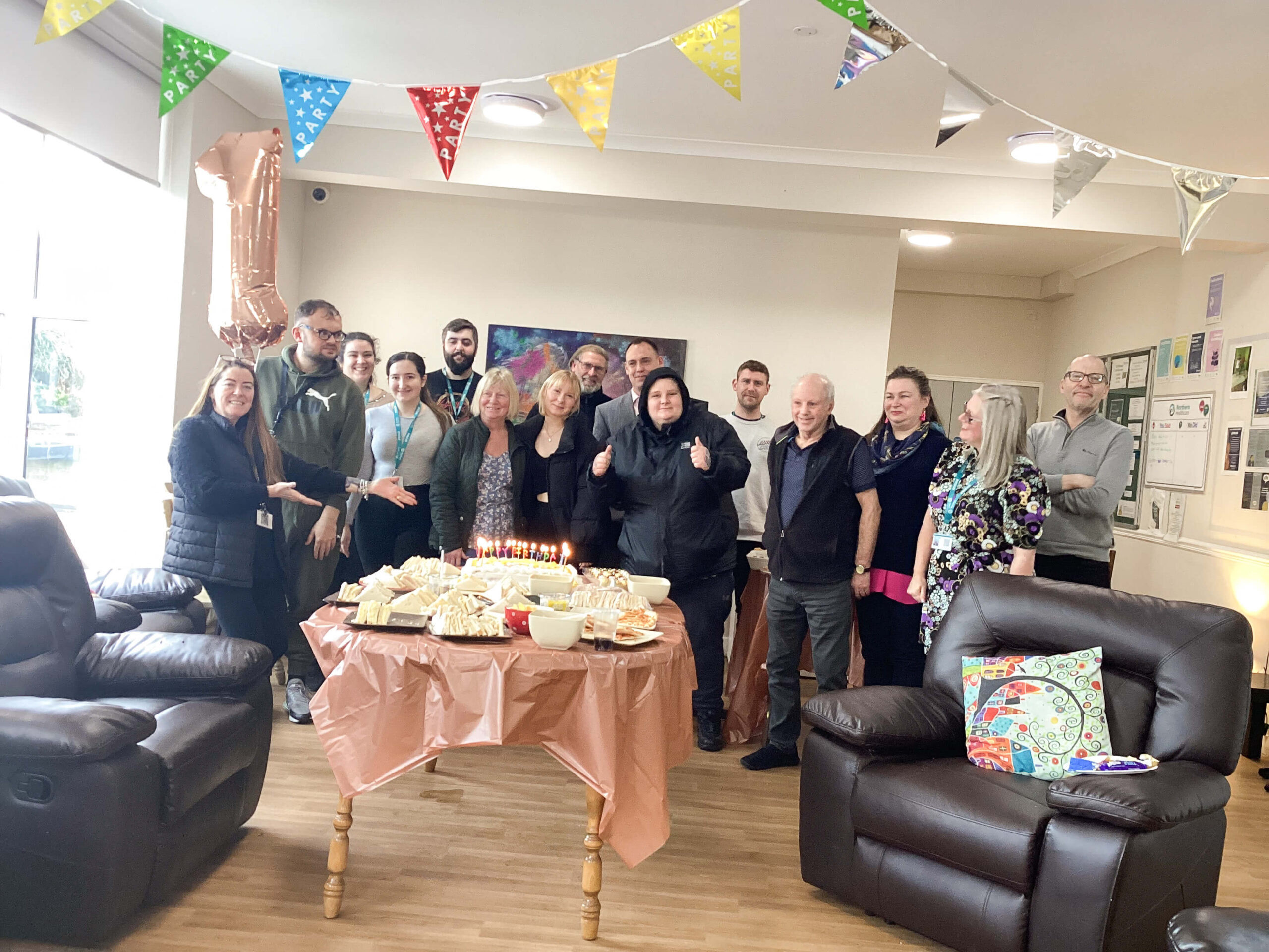Kirk House team and residents celebrating